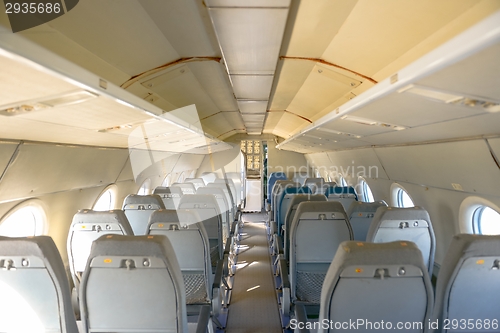 Image of Interior of an airplane with many seats