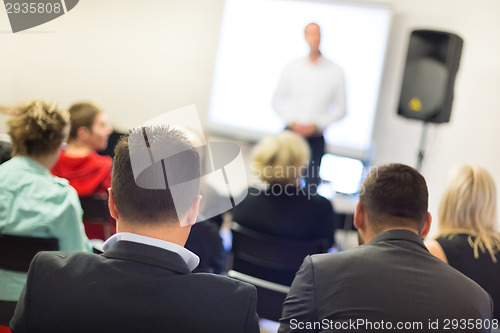 Image of Speaker at Business convention and Presentation.