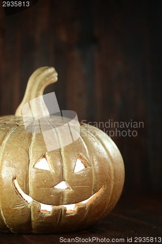 Image of Halloween Pumpkin on Wood Grunge Rustic Background