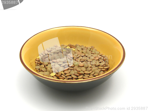 Image of lentils  in a bowl of ceramic on white background