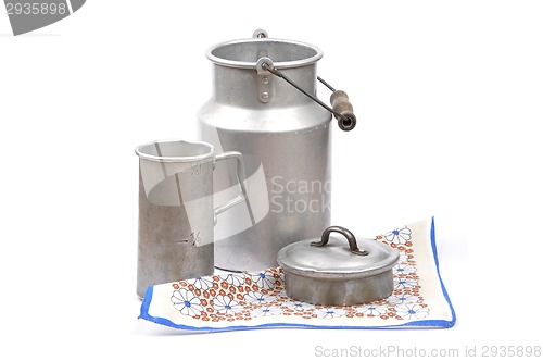 Image of Graduated jug and milk can