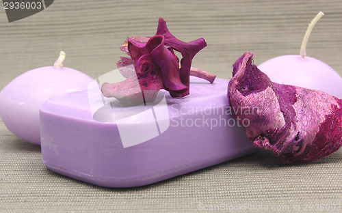 Image of Lilac soap with decoration articles on a  gray  background