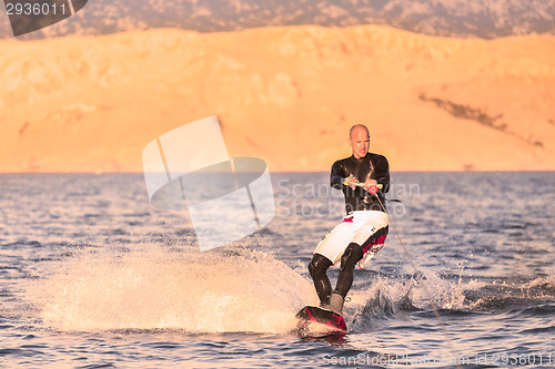 Image of Wakeboarder in sunset.