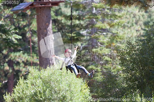 Image of kid in adventure park