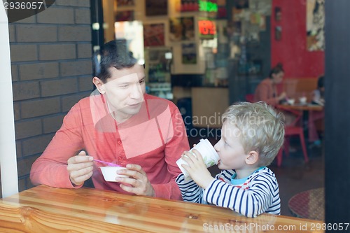 Image of family in cafe