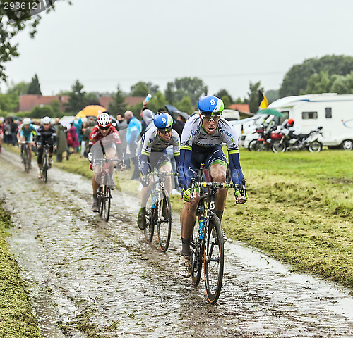 Image of The Cyclist Mathew Hayman on a Cobbled Road - Tour de France 201