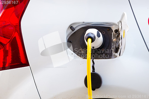 Image of Electric Car in Charging Station.