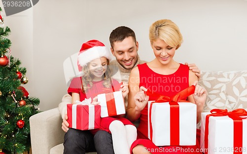 Image of happy family opening gift boxes