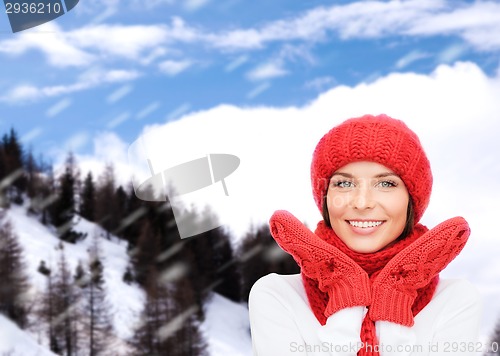 Image of smiling young woman in winter clothes