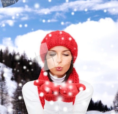 Image of smiling young woman in winter clothes