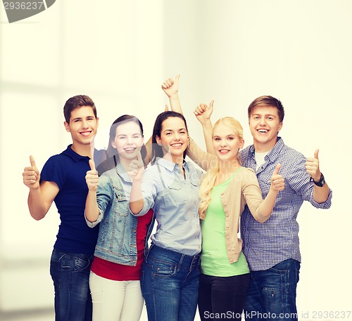 Image of group of smiling students showing thumbs up