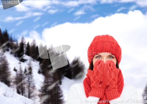 Image of smiling young woman in winter clothes