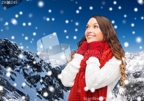 Image of smiling young woman in winter clothes