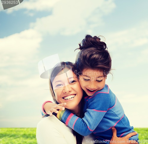 Image of hugging mother and daughter