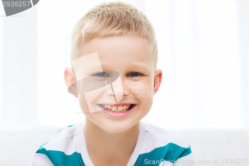 Image of smiling little student boy at home