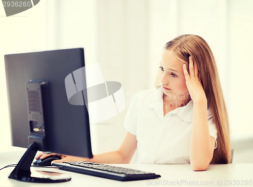 Image of student girl with computer at school
