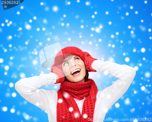 Image of smiling young woman in winter clothes