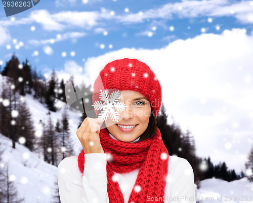 Image of smiling young woman in winter clothes