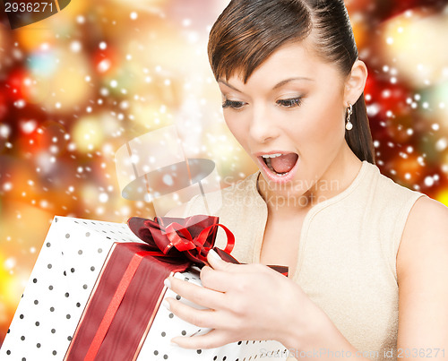 Image of happy asian woman with gift box