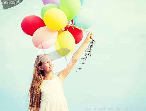 Image of happy girl with colorful balloons