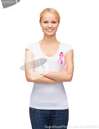 Image of smiling woman with pink cancer awareness ribbon