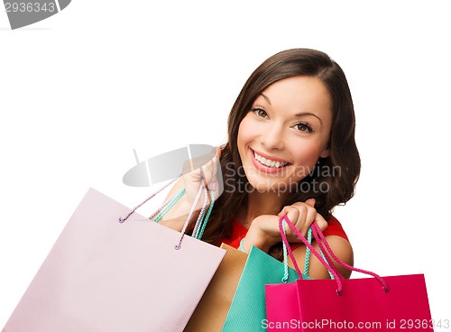 Image of woman in red dress with shopping bags