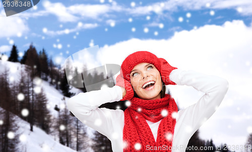 Image of smiling young woman in winter clothes