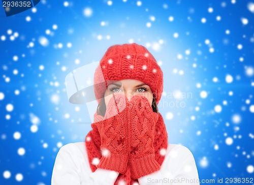 Image of smiling young woman in winter clothes