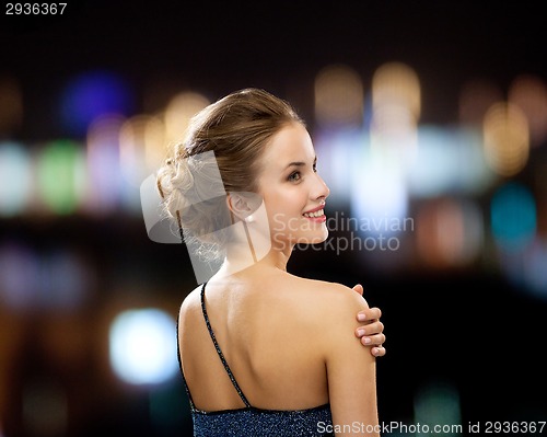 Image of smiling woman in evening dress