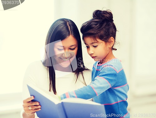 Image of mother and daughter with book
