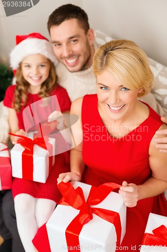 Image of happy family opening gift boxes