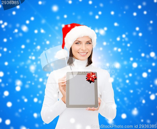 Image of woman in santa helper hat with tablet pc