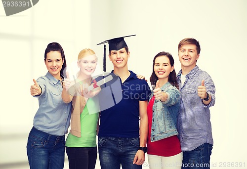 Image of group of students with diploma showing thumbs up