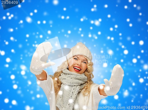 Image of smiling young woman in winter clothes