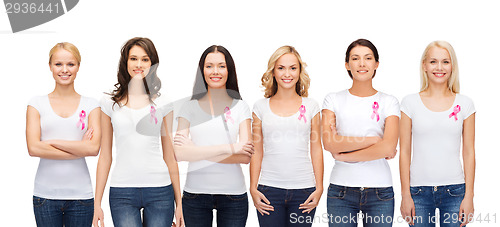 Image of smiling women with pink cancer awareness ribbons