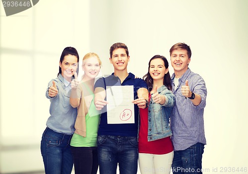 Image of group of students showing test and thumbs up