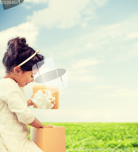 Image of happy child girl with gift box