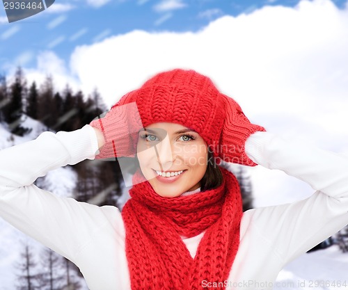 Image of smiling young woman in winter clothes