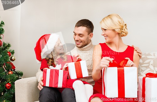 Image of happy family opening gift boxes