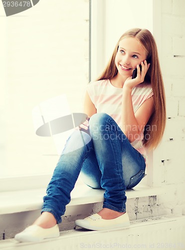 Image of girl with smartphone at school