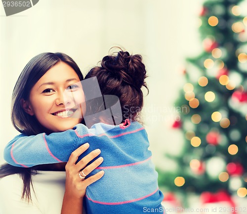 Image of hugging mother and daughter