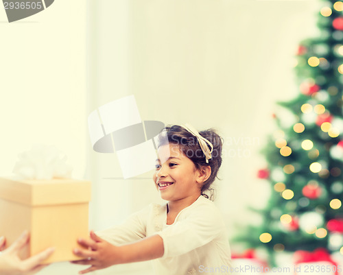 Image of happy child girl with gift box