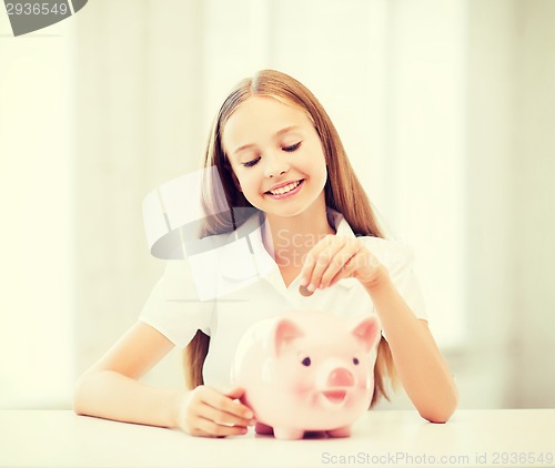 Image of child with piggy bank