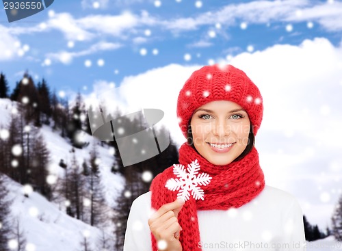 Image of smiling young woman in winter clothes