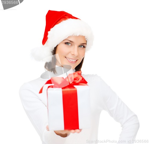 Image of smiling woman in santa helper hat with gift box