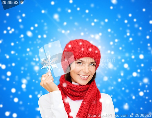 Image of smiling young woman in winter clothes