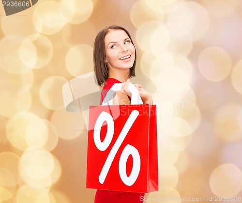Image of woman in red dress with shopping bags