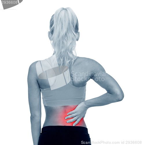 Image of sporty woman touching her back