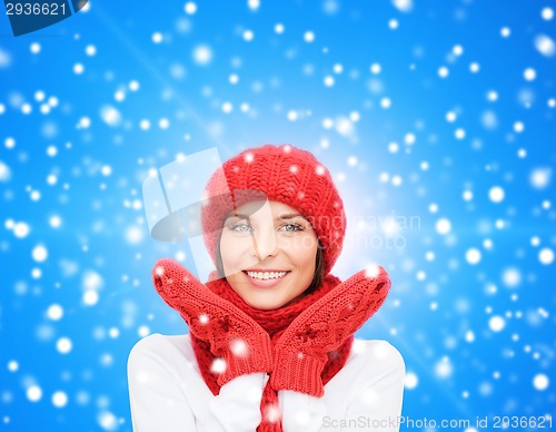 Image of smiling young woman in winter clothes