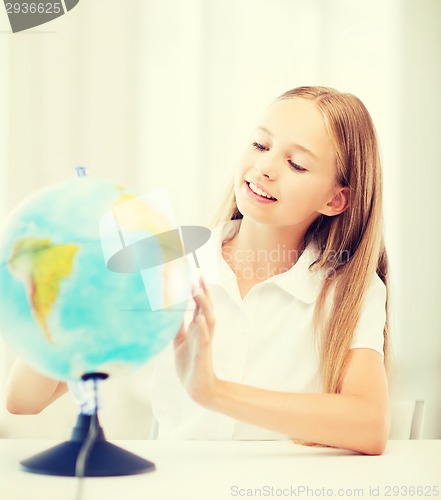 Image of student girl with globe at school